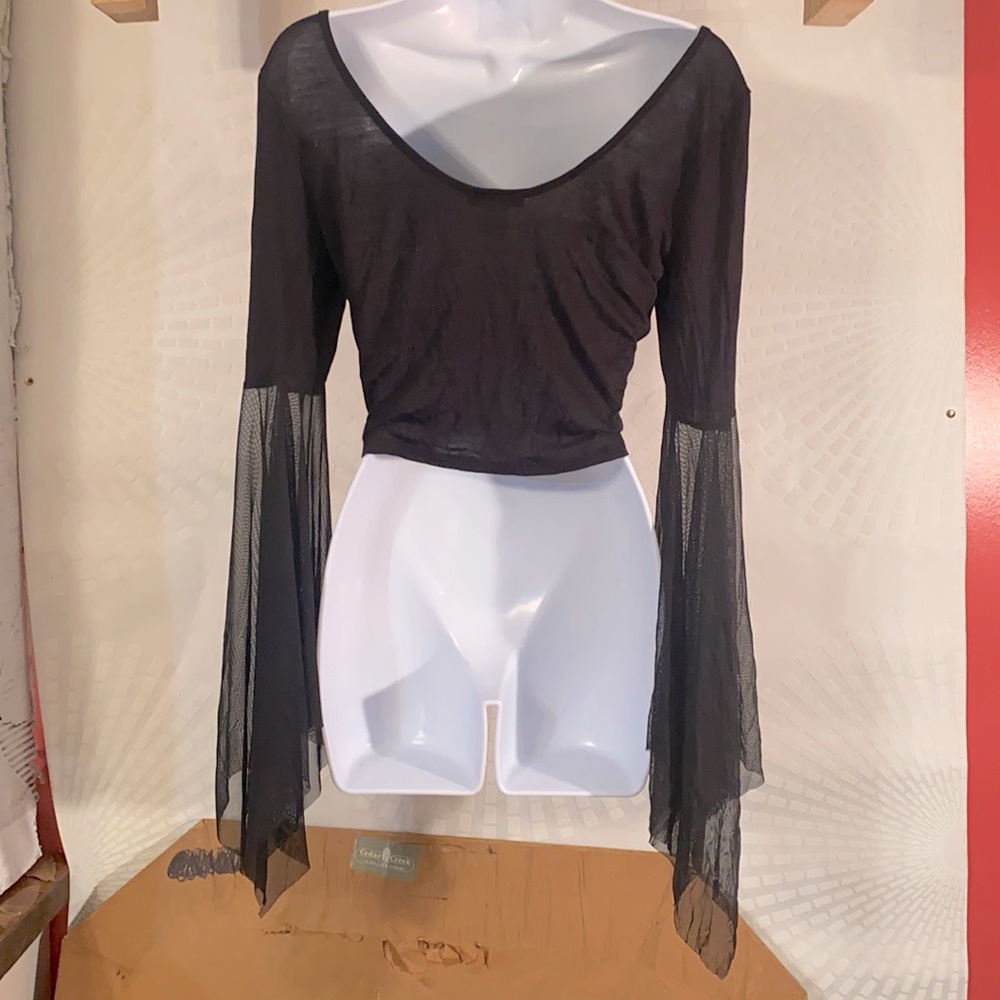 Woman’s black crop top with lace sleeves